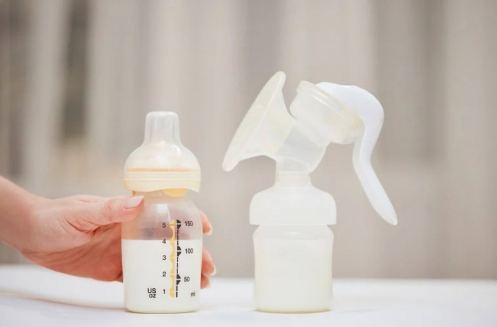 Breast milk collected in a pump bottle ready for feeding or storage